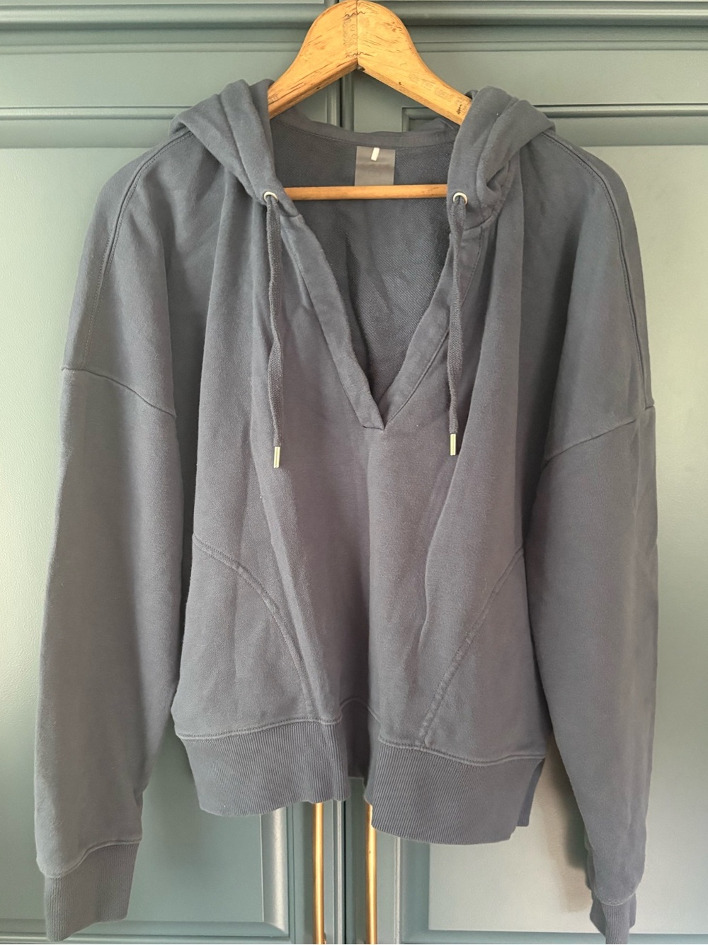 Blue Calia by Carrie Underwood hoodie features a distinctive split neck design